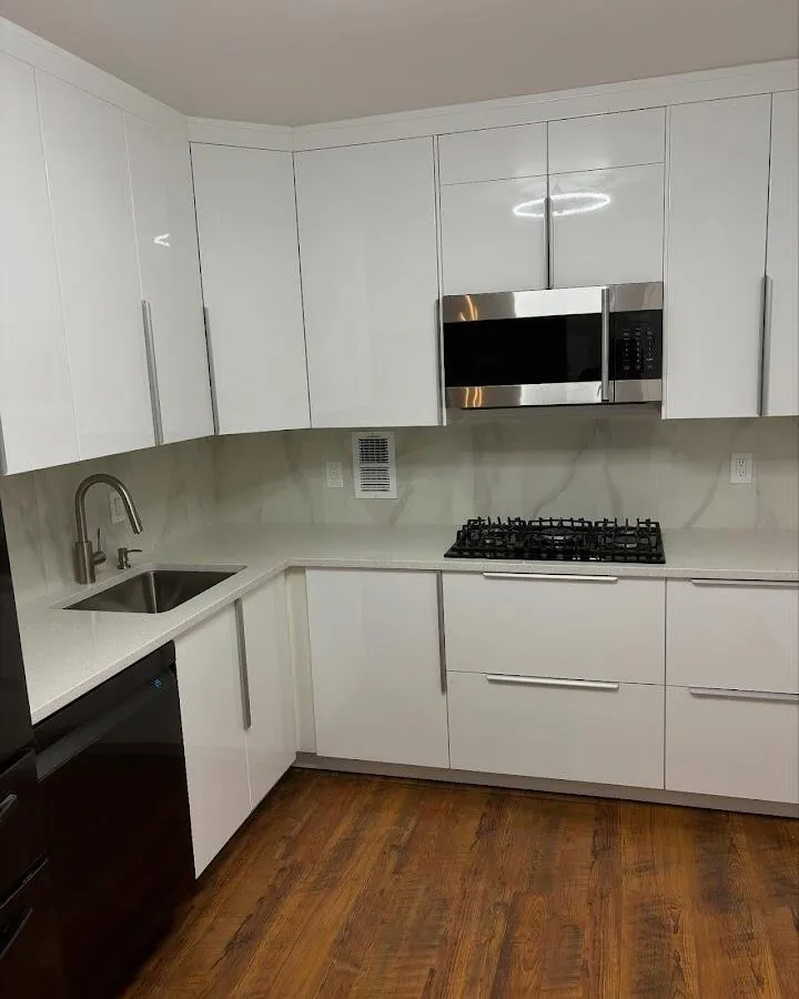 Restored kitchen with white cabinets after water damage in Grenada